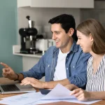 Homeowners review a roofing quote in Houston