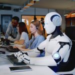 A robot sits inside of a call center taking calls