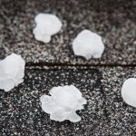 A roof with large balls of hail on top of it in Houston