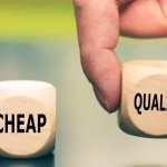 Two blocks that say “cheap” and quality” and a hand picking up “quality”