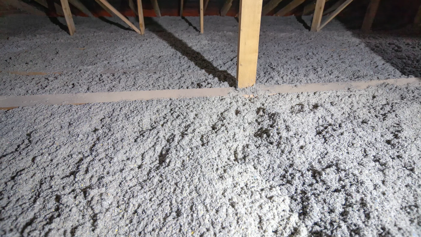 An attic insulated with blown-in insulation