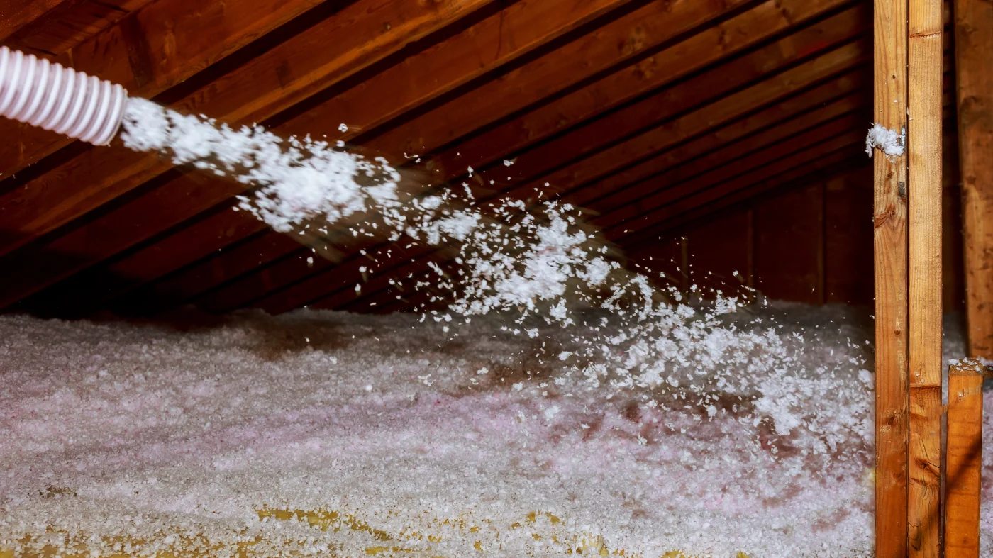 Attic insulation being installed  in Katy, TX