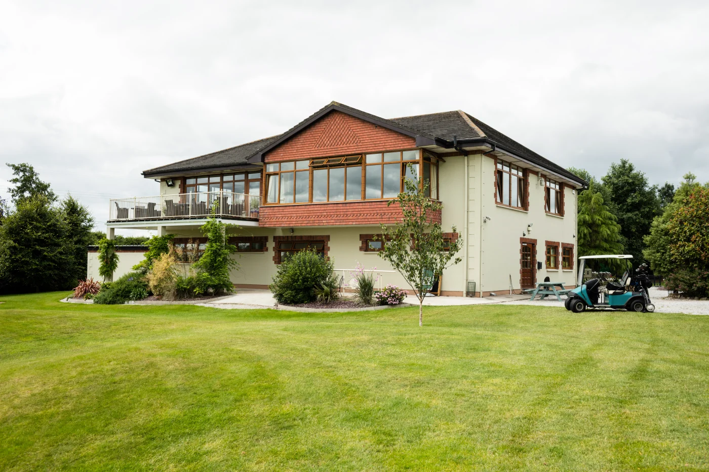 Beautiful two story modern home with shingled roof and wood siding