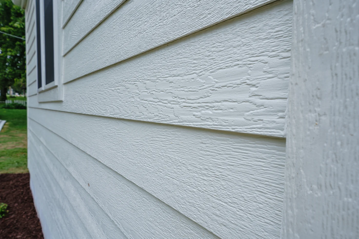 up close view of lp smartside siding on a family home