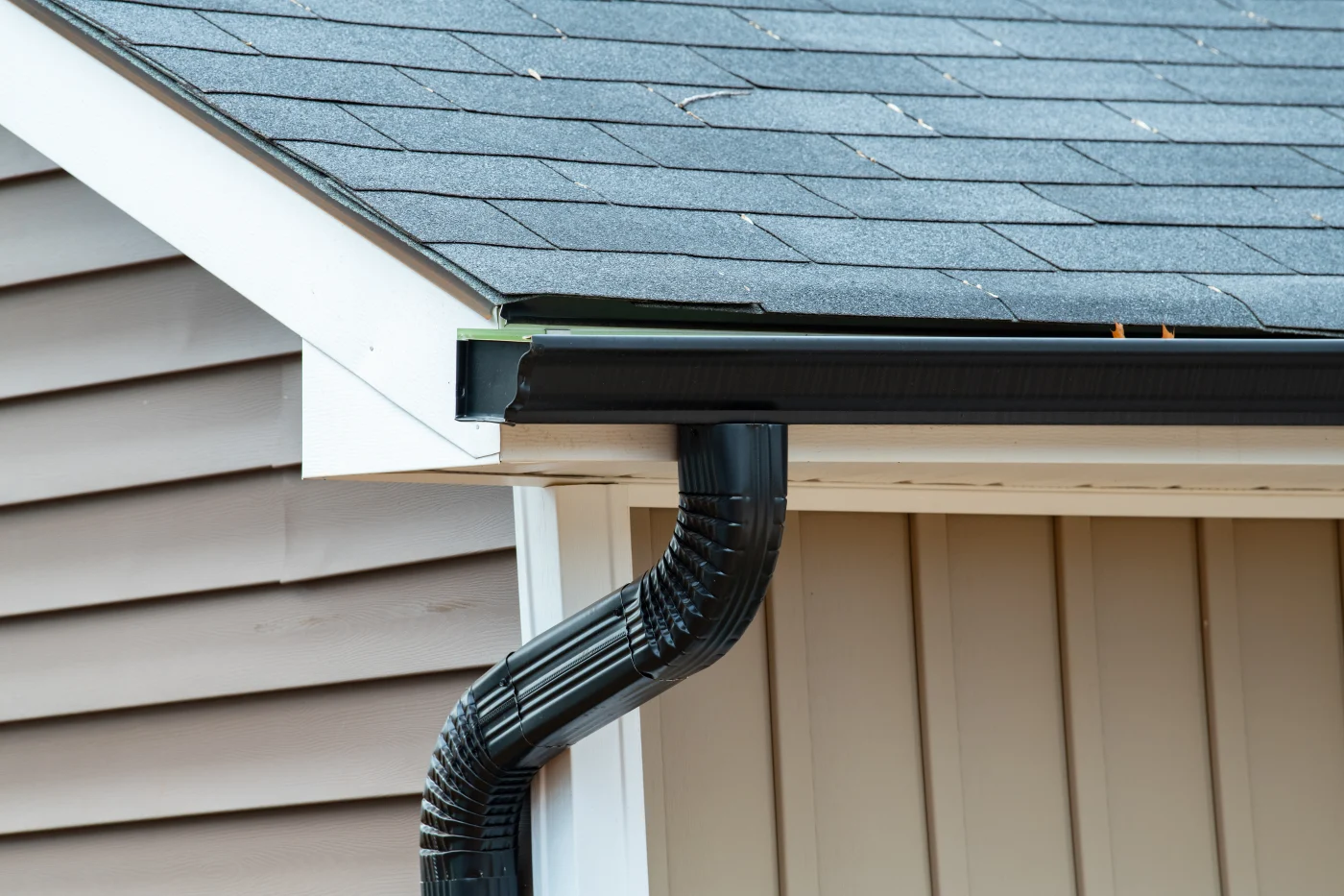 Gutters being attached to roof edge