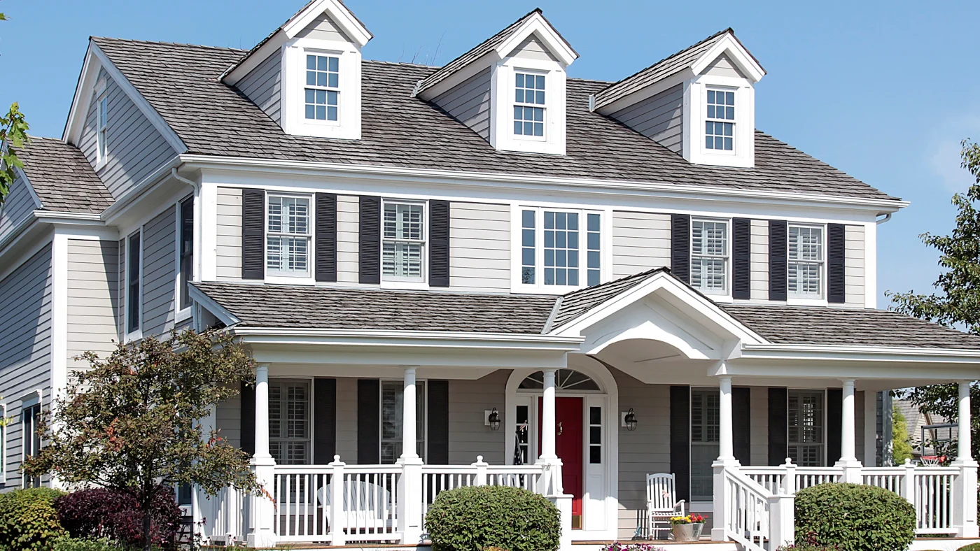 A home with white siding and black shutters