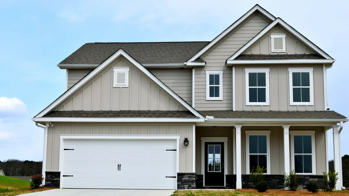 A home with tan siding and white trim