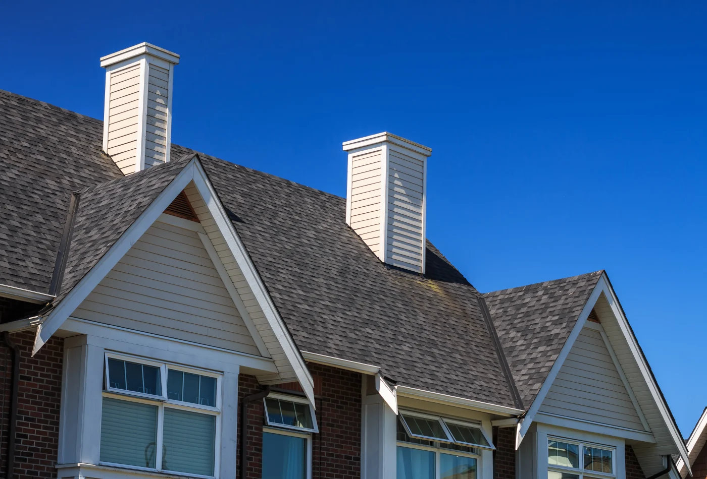 Proper Roofing crew installing shingles on a residential Memorial roof