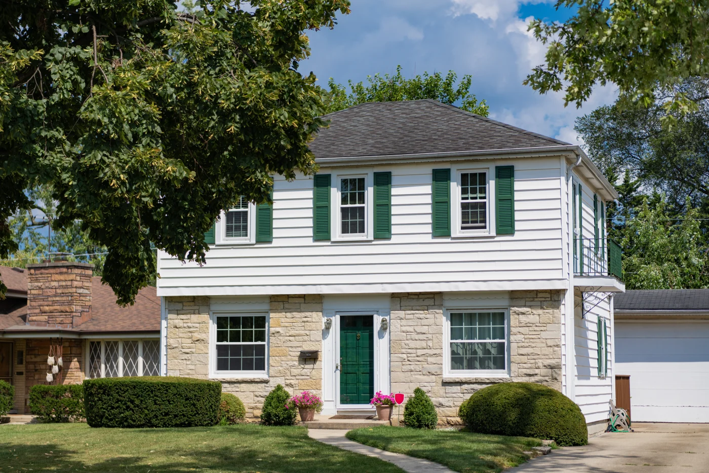 Suburban two story home with a new shingled roof