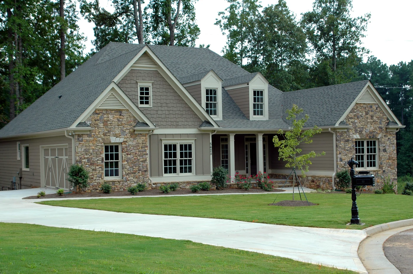 Roofing team installs shingles on a steep-pitch Pasadena roof