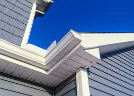 View of new L P smart side soffit and fascia on home with blue siding