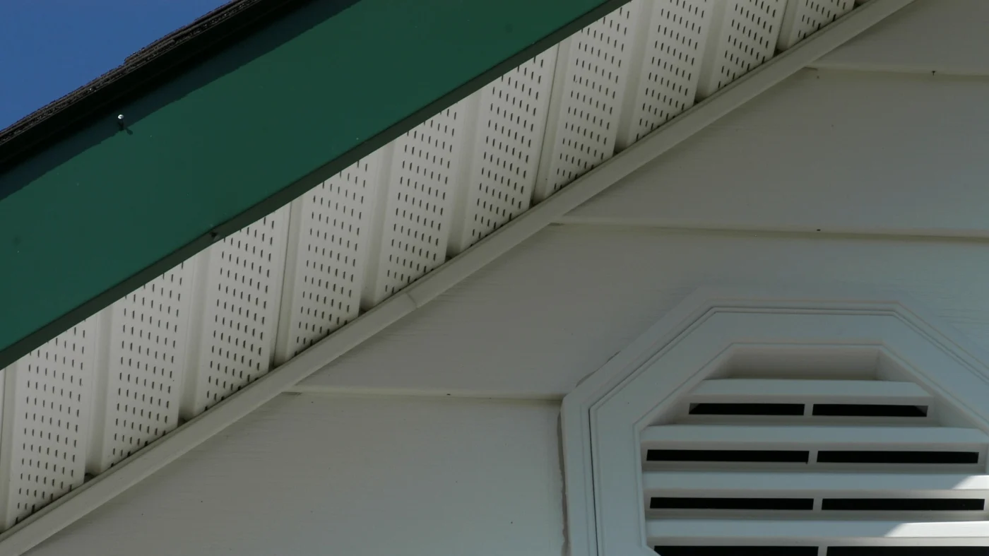 A white soffit and green fascia