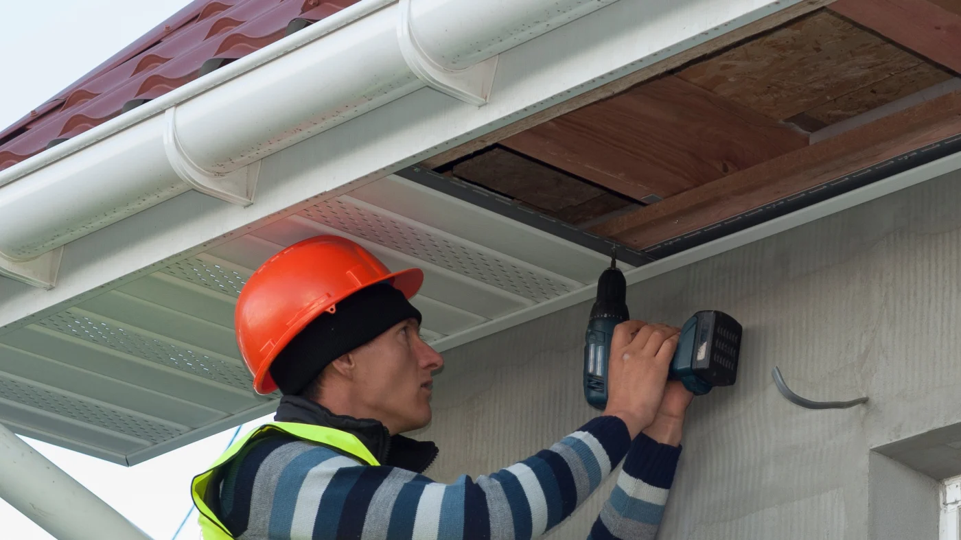 A contractor installs a new soffit