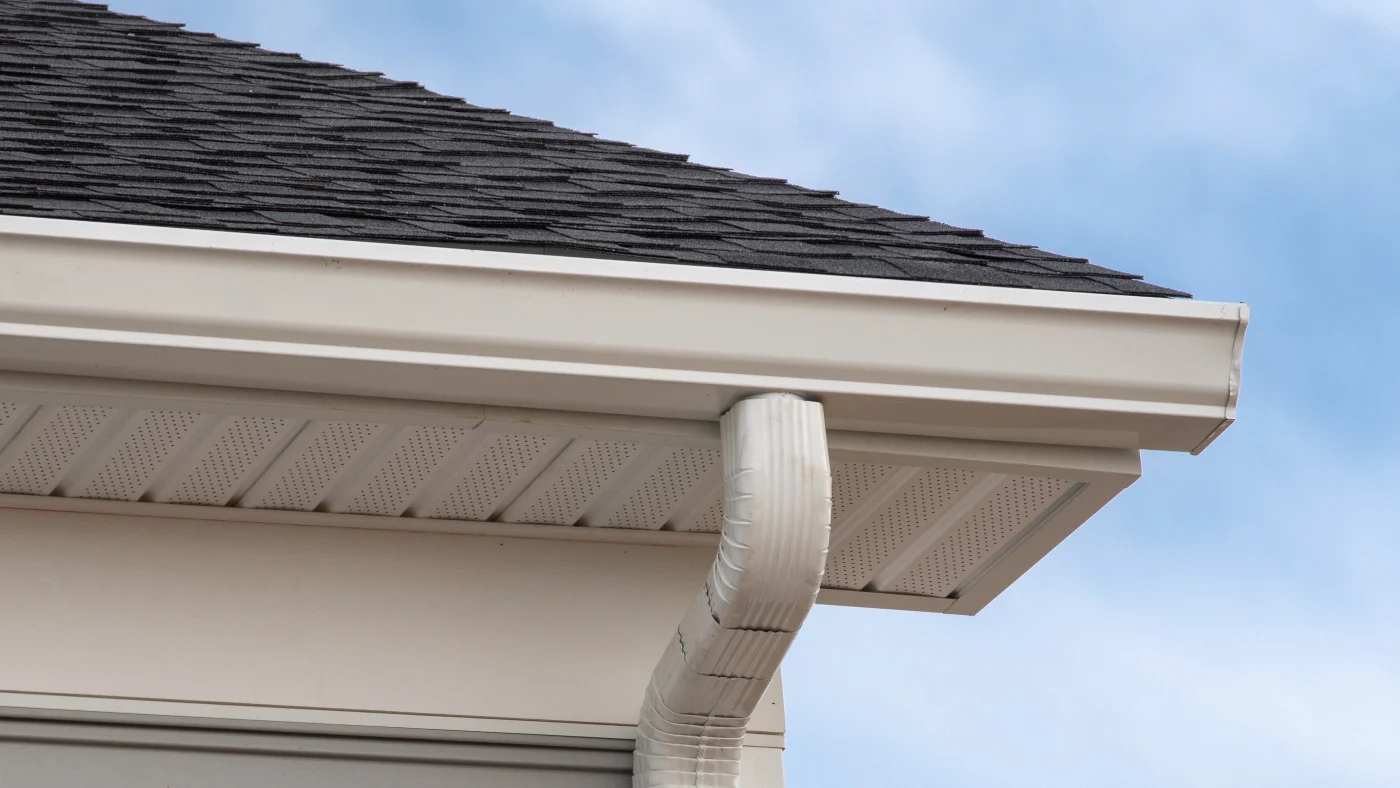 An upward view of a soffit and gutter