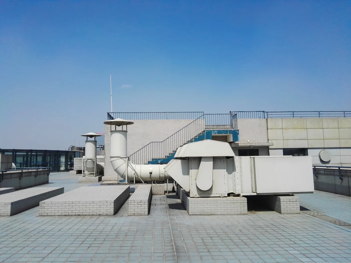 Industrial roofing installations with appliances on top of roof